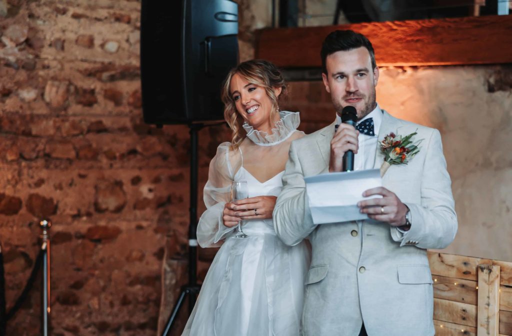 Bride and Groom Giving Speech at Wedding