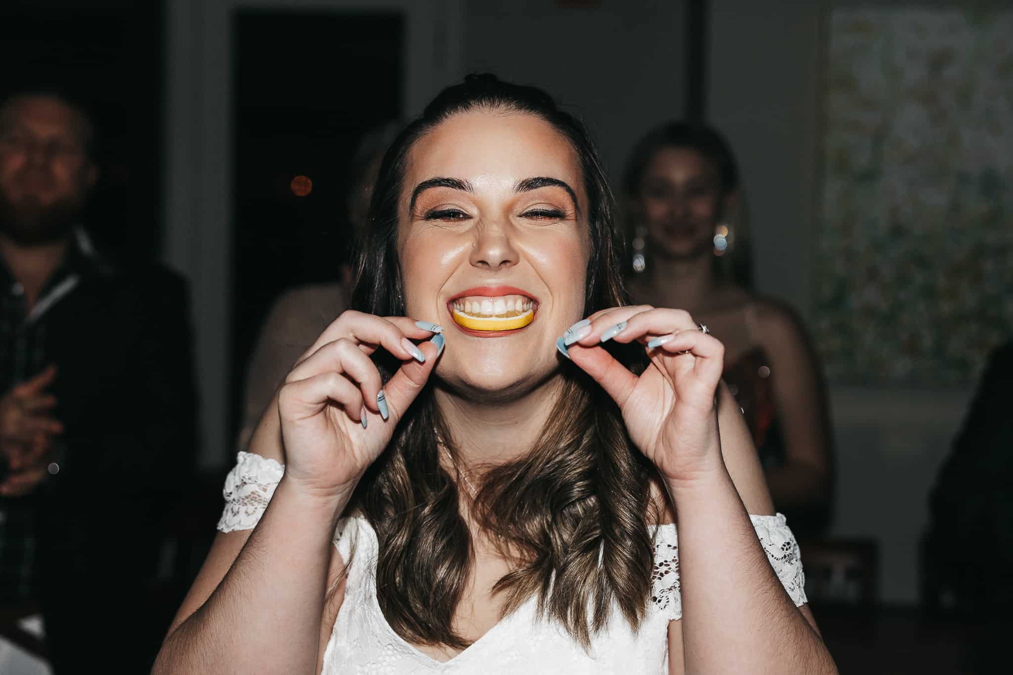 Bride eating lemon